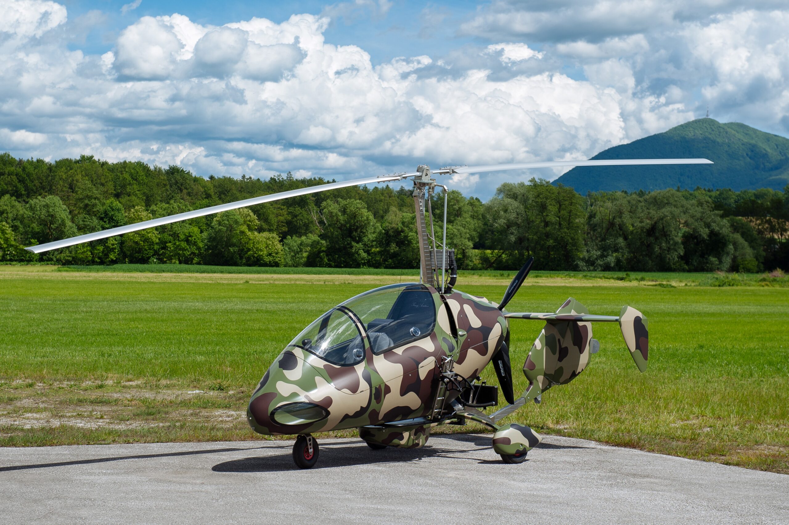 gyrocopter sitting on airstrip